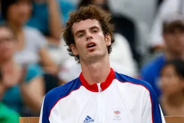 Andy Murray in action on the tennis court.