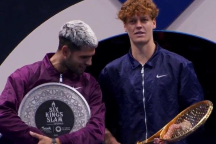 Carlos Alcaraz and Jannik Sinner in a tennis match.