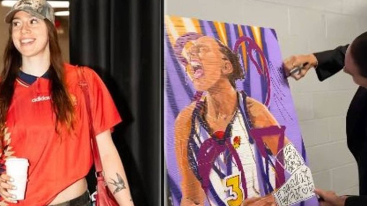 Marta Suárez, giocatrice spagnola in WNBA, mostra un dipinto a Diana Taurasi, icona del basket