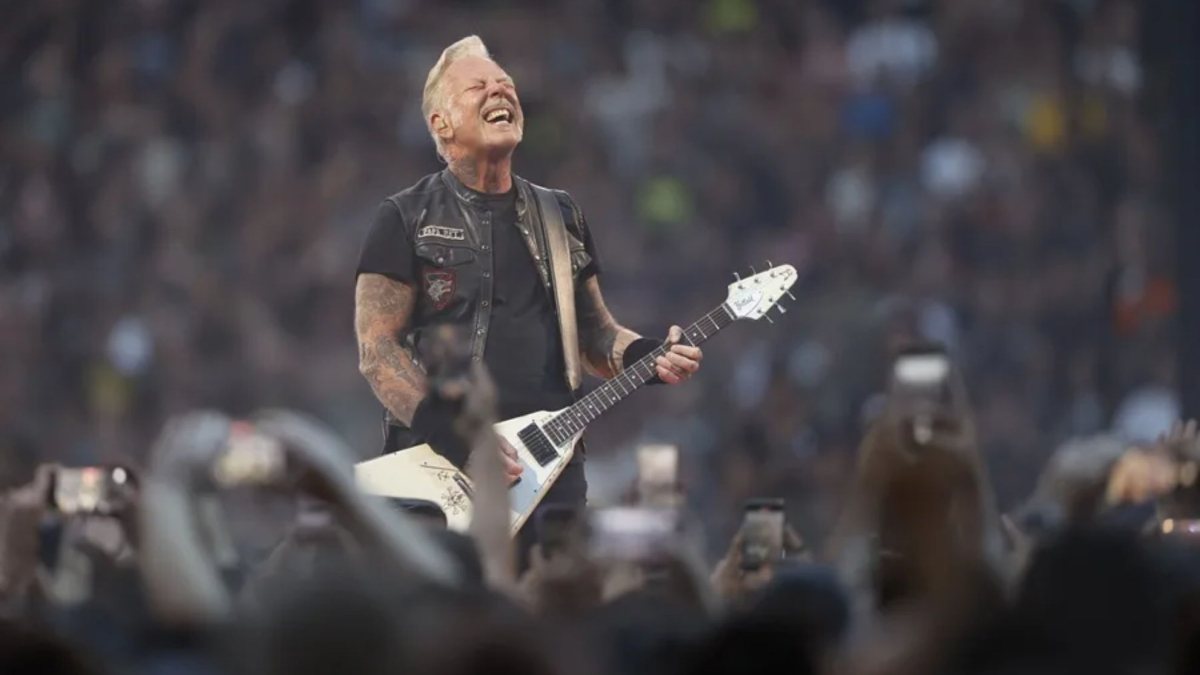 James Hetfield and partner Andriana Gillett kissed at NFL game