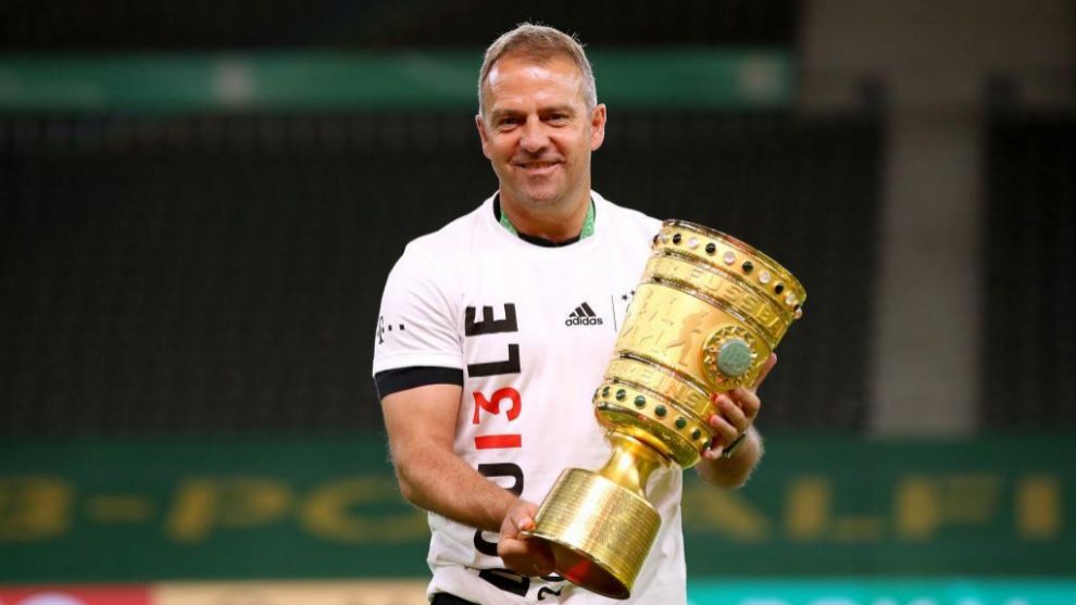 Hans-Dieter Flick lifts the German Champion's Cup.