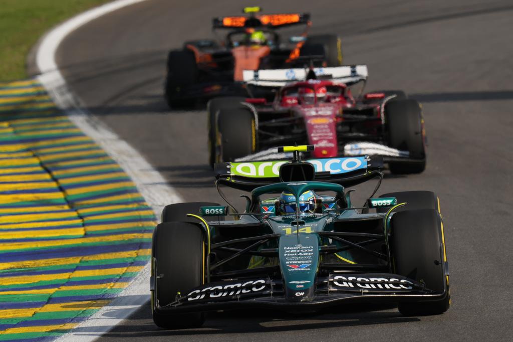 Aston Martin driver Fernando Alonso of Spain leads Ferrari driver Charles Leclerc of Monaco and McLaren driver Lando Norris of Britain during the sprint qualifying event for the Brazilian Formula One Grand Prix auto race at Interlagos race track in Sao Paulo, Friday, Nov. 7, 2025. (AP Photo/Andre Penner)