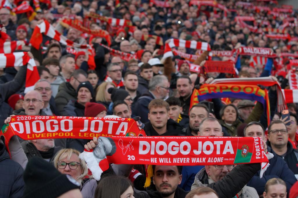 Liverpool fans, with scarves in memory of Diogo Jota.