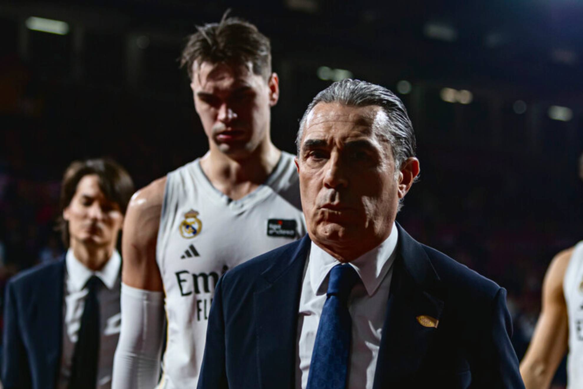 Scariolo heads into the locker room tunnel followed by Hezonja in a Madrid match.