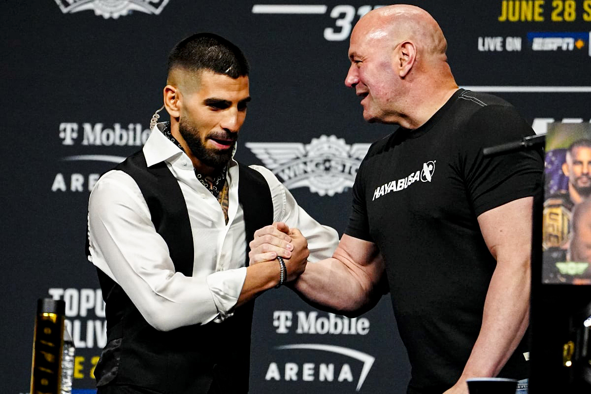 Ilia Topuria greets Dana White.