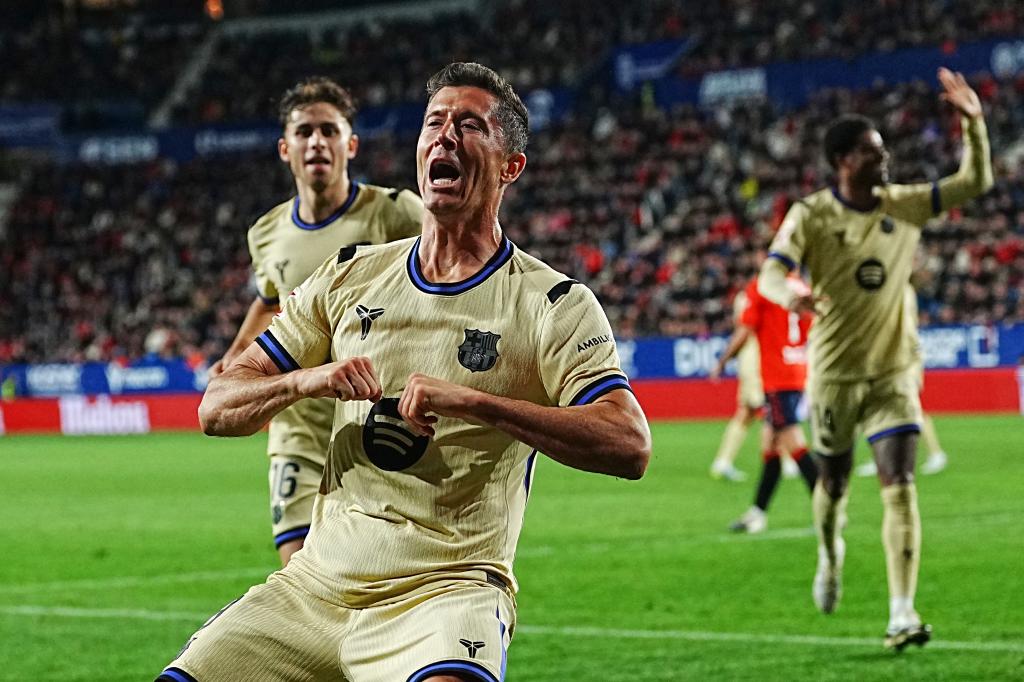 Barcelona's Robert Lewandowski celebrates after scoring his side's opening goal during a Spanish La Liga soccer match between Osasuna and Barcelona in Pamplona, Spain, Saturday, May 2, 2026. (AP Photo/Miguel Oses)