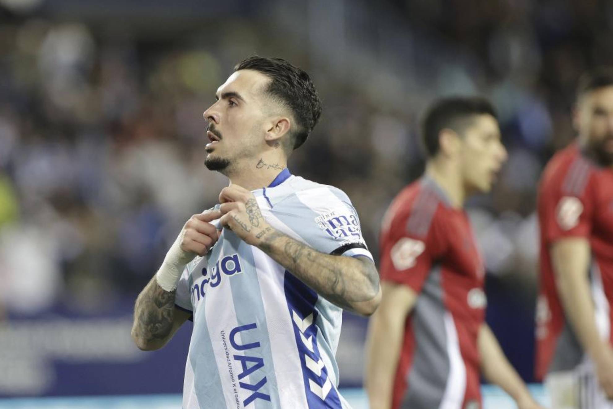 Joaquín Muñoz celebra un gol con el Málaga.