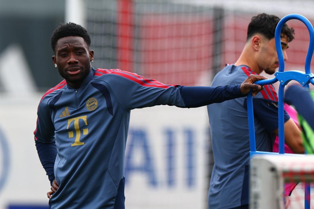Alphonso Davies wears tape in one ear and an earring in the other.