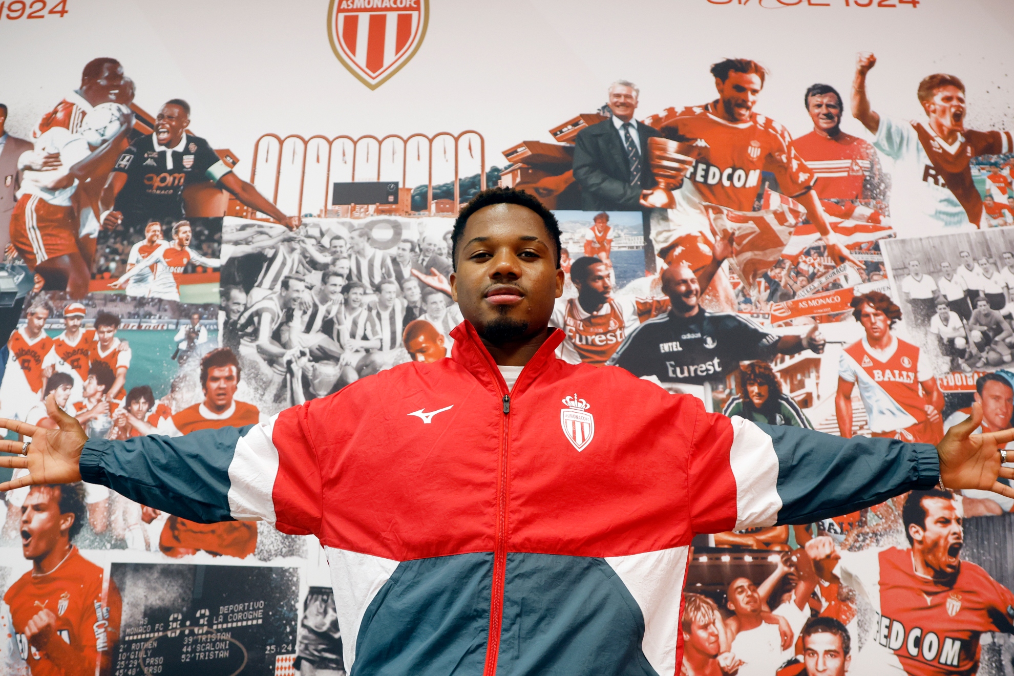 In front of a mural with Monaco's most important players.
