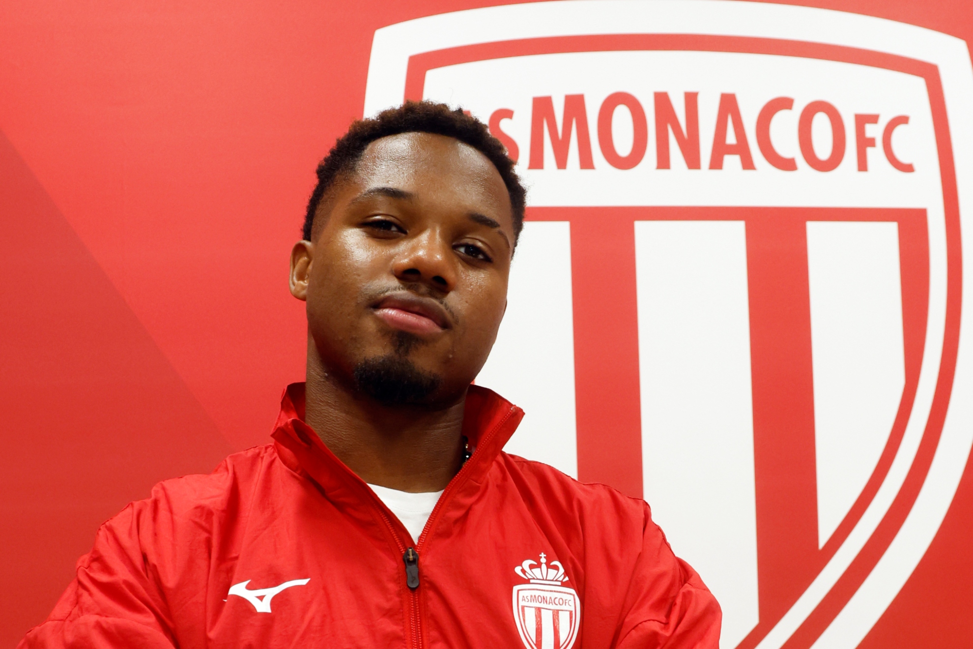 In front of the Monaco shield.