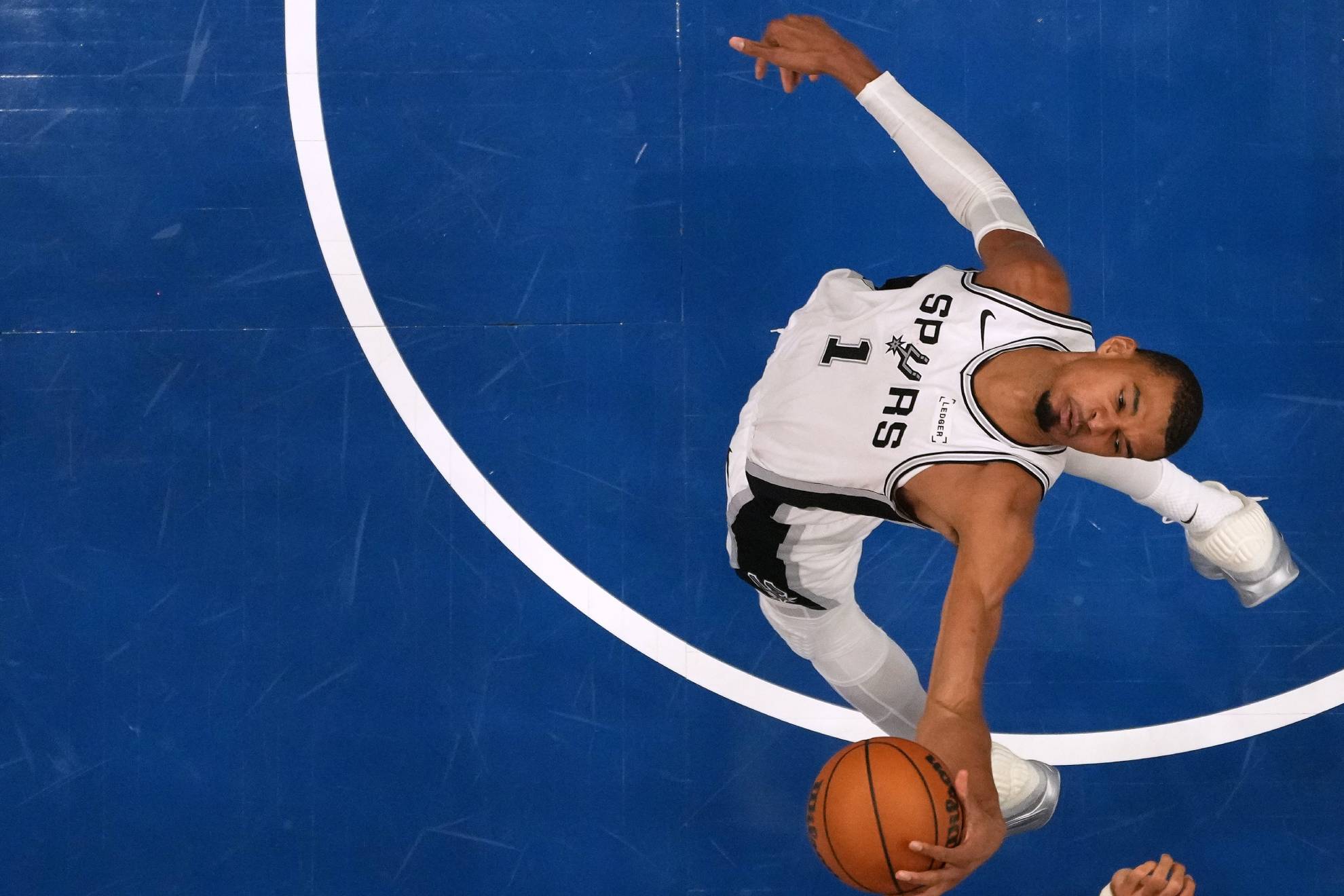 San Antonio Spurs forward Victor Wembanyama (1) grabs a rebound during the second half of Game 3 of a NBA basketball second-round playoff series against the Minnesota Timberwolves, Friday, May 8, 2026, in Minneapolis. (AP Photo/Abbie Parr)