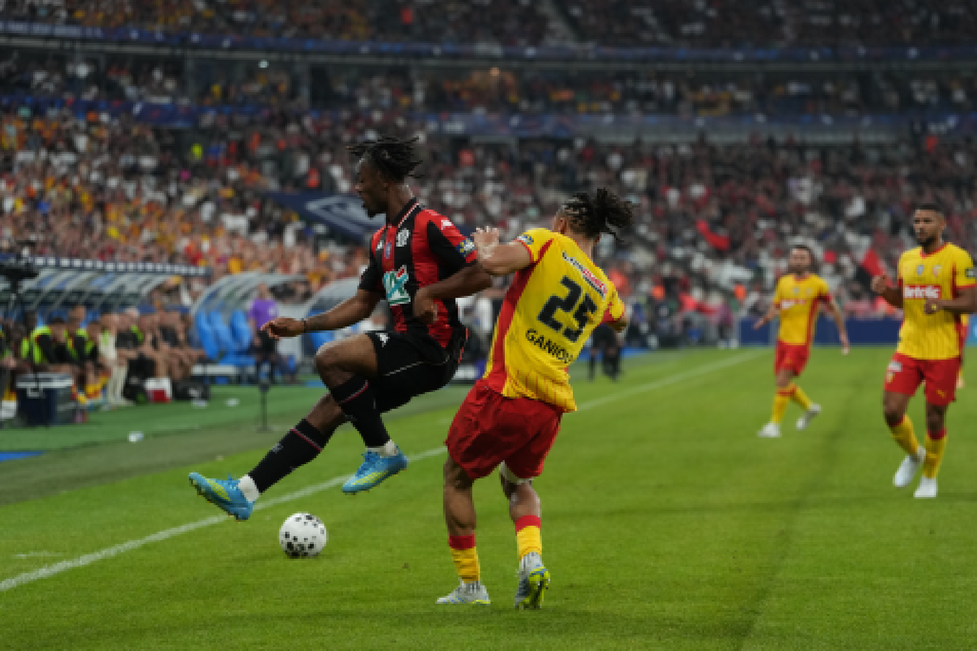 A dispute over the ball between players from both teams