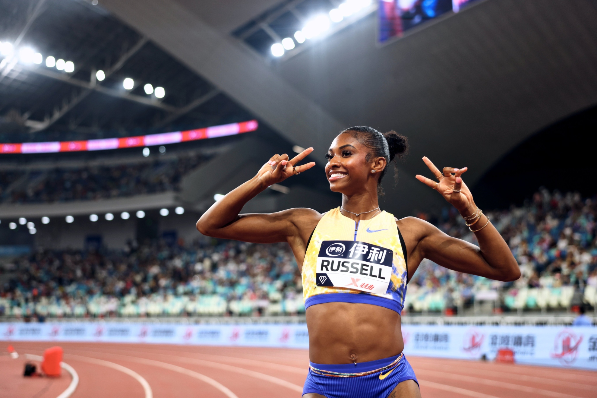Masai Russell tras ganar la carrera en Xiamen.