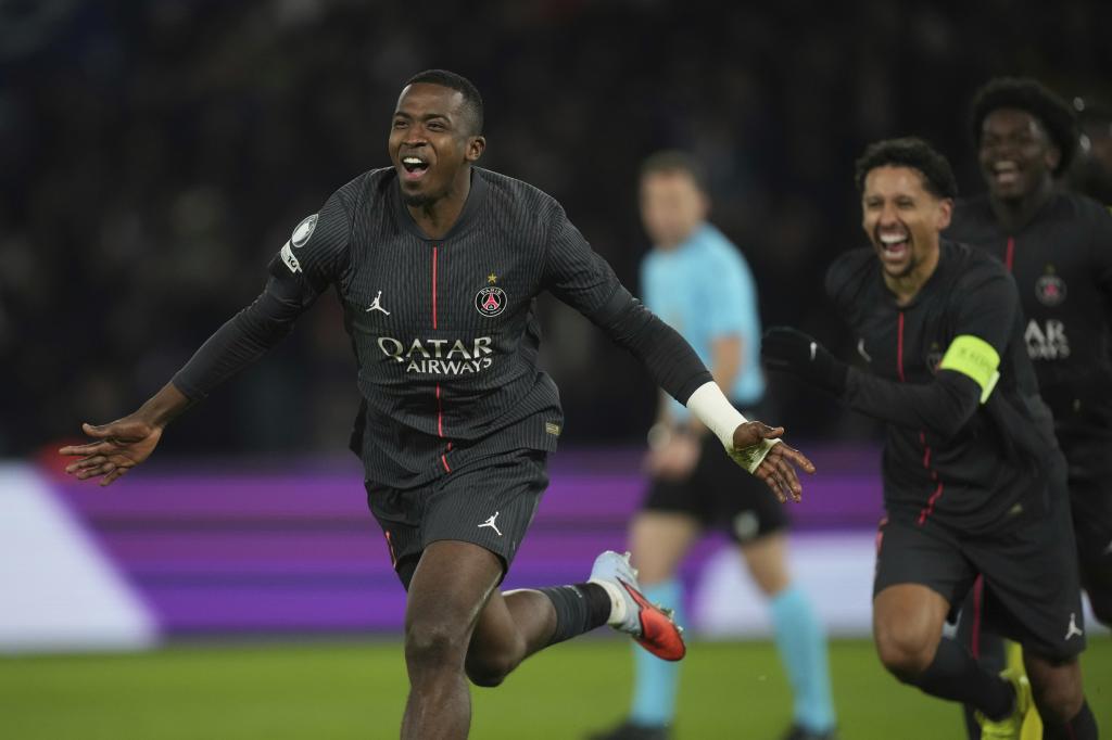 Willian Pacho celebrates a goal with PSG.