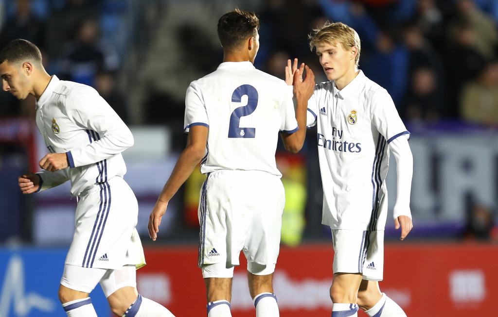 Achraf Hakimi and Martin Odegaard celebrate a goal for Castilla.