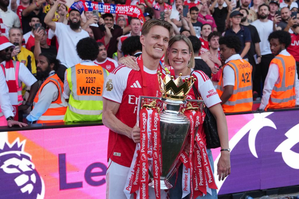 Martin Odegaard celebrates winning the Premier League with his wife, Helene Spilling.