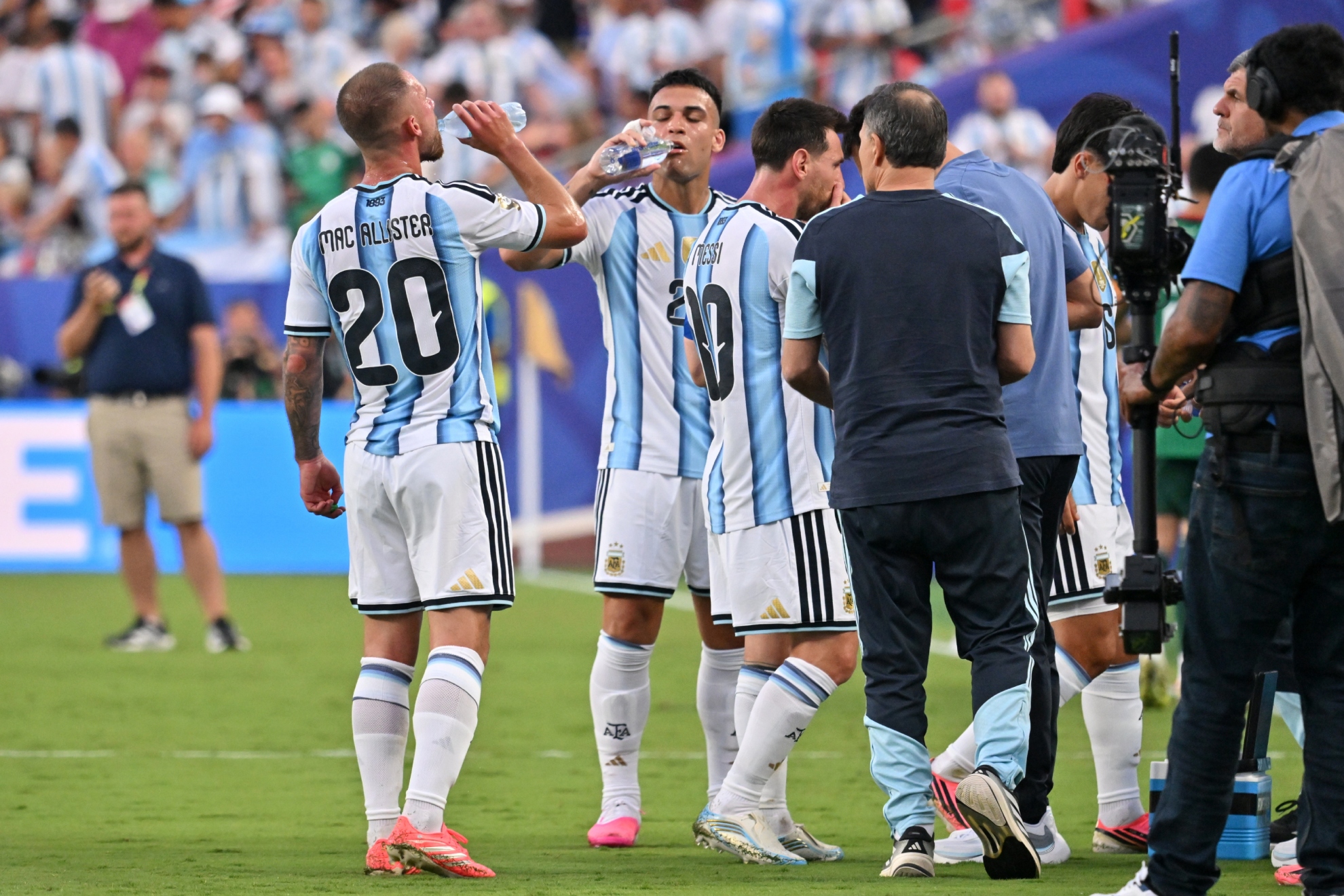 Argentina's players cool off during a break.