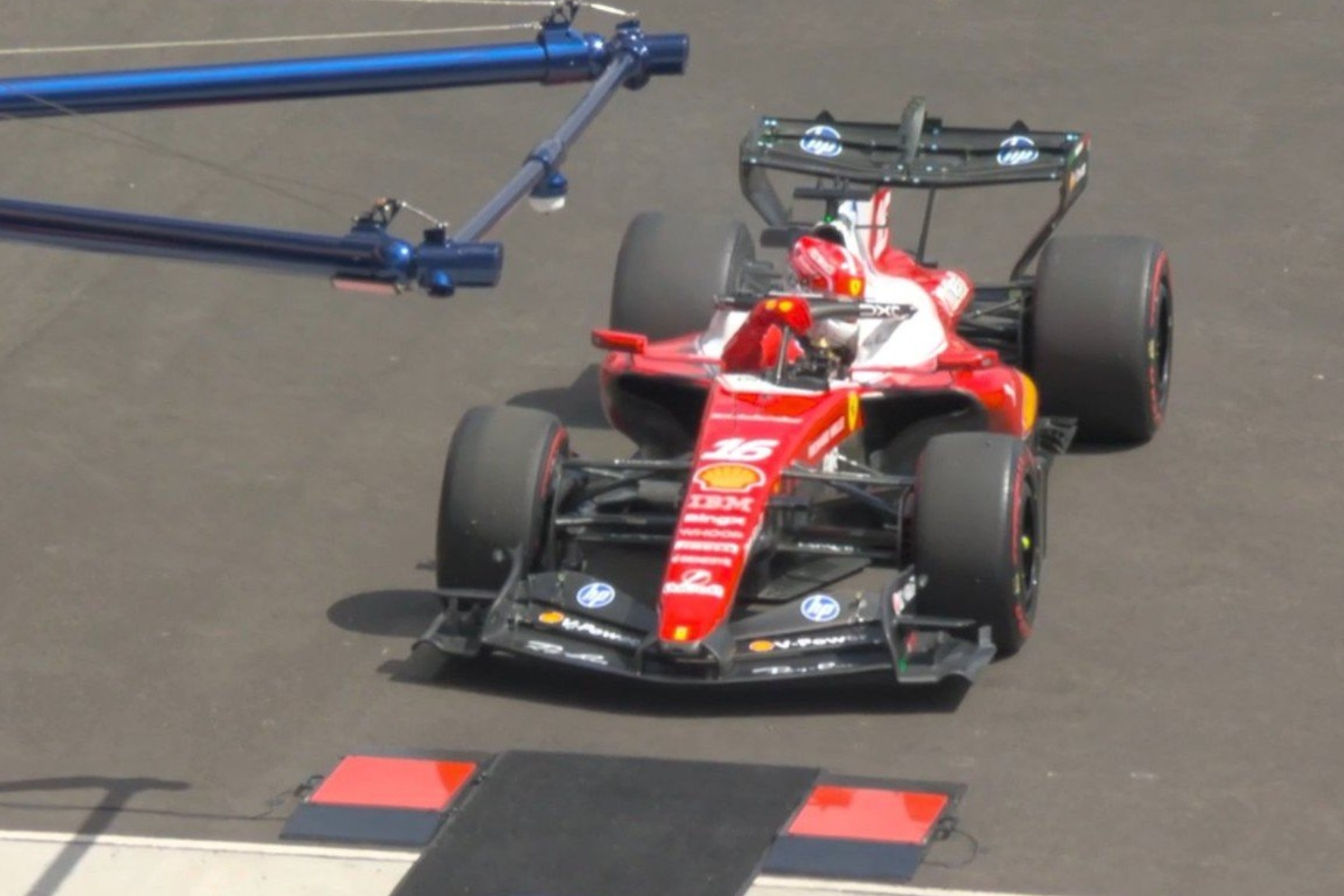 Leclerc gets out of the Ferrari.