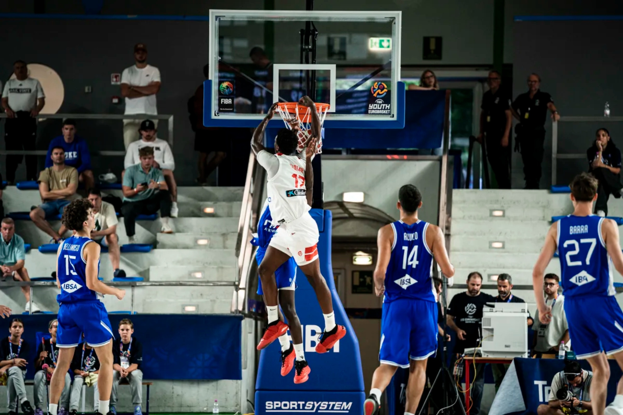 Cheik Diallo makes a dunk during the match.