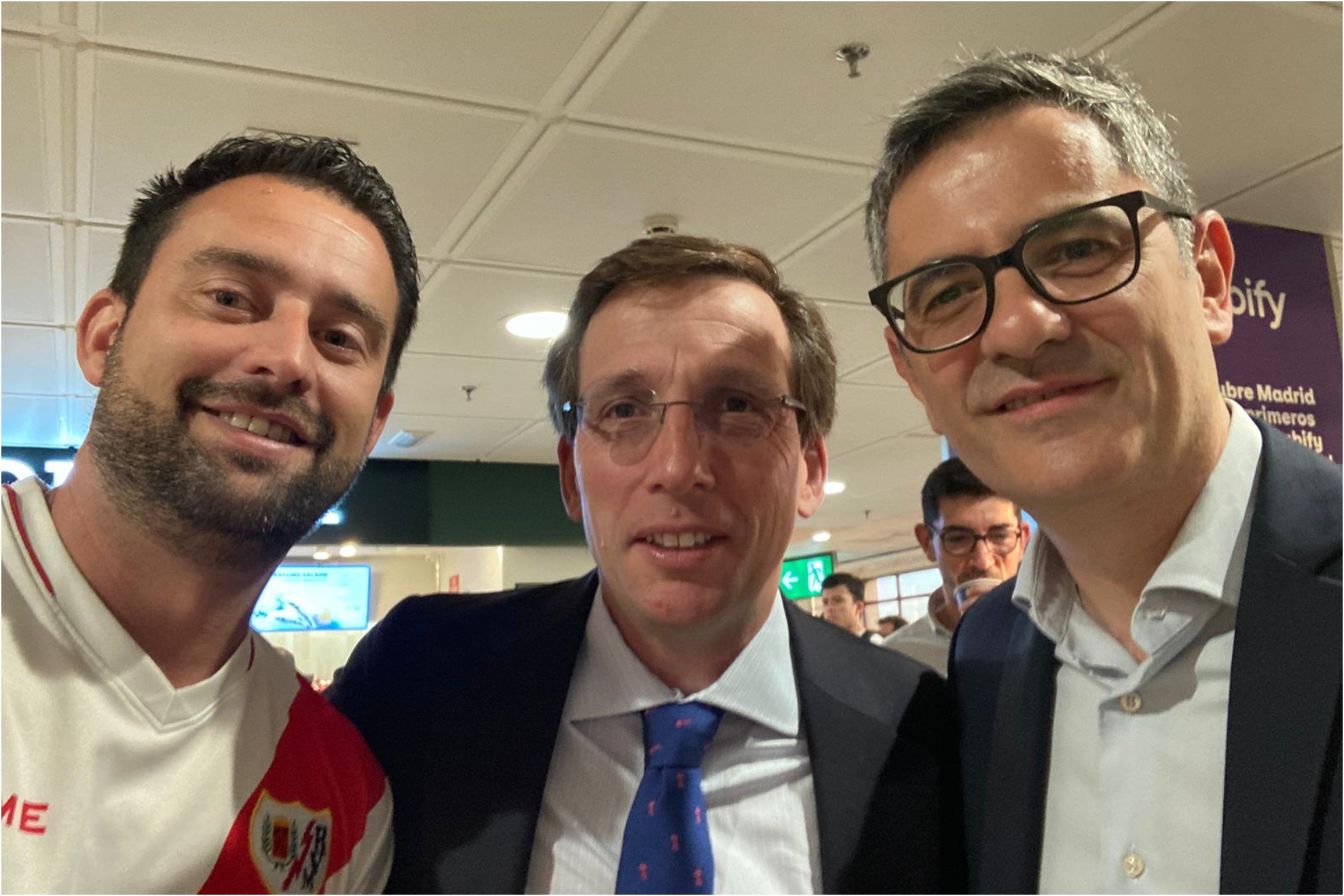 A Rayo fan takes a selfie with Almeida and Bolaños before flying to Leipzig.