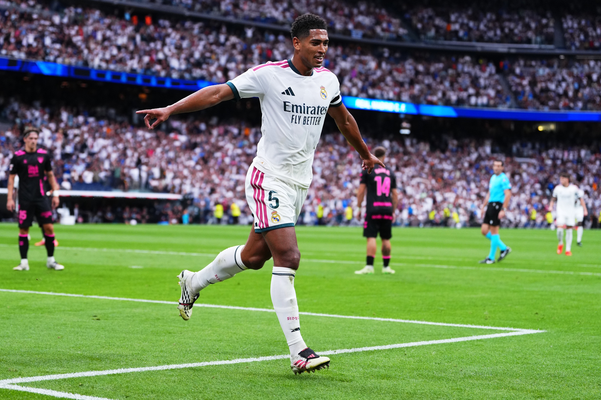 Real Madrid's Jude Bellingham celebrates Malaga's own goal during the La Liga soccer match between Real Madrid and Malaga in Madrid, Spain, Sunday, Aug. 30, 2026. (AP Photo/Manu Fernandez)