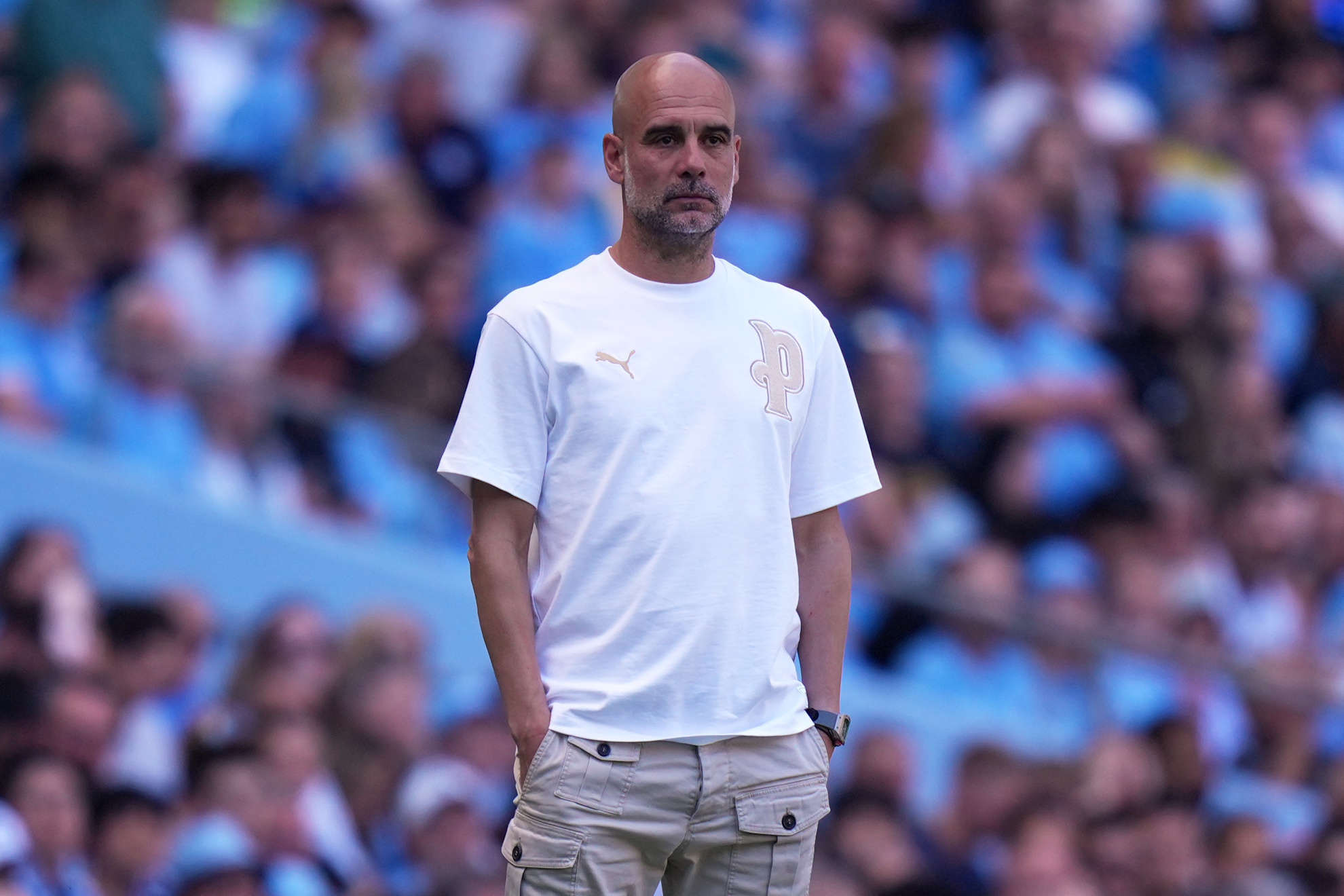 Manchester City's head coach Pep Guardiola watches from sideline during a Premier League soccer match between Manchester City and Aston Villa in Manchester, England, Sunday, May 24, 2026. (AP Photo/Alastair Grant)