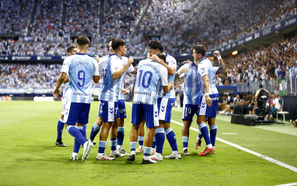 Los jugadores del Málaga celebran un gol ante el Villarreal. MARILU BAEZ
